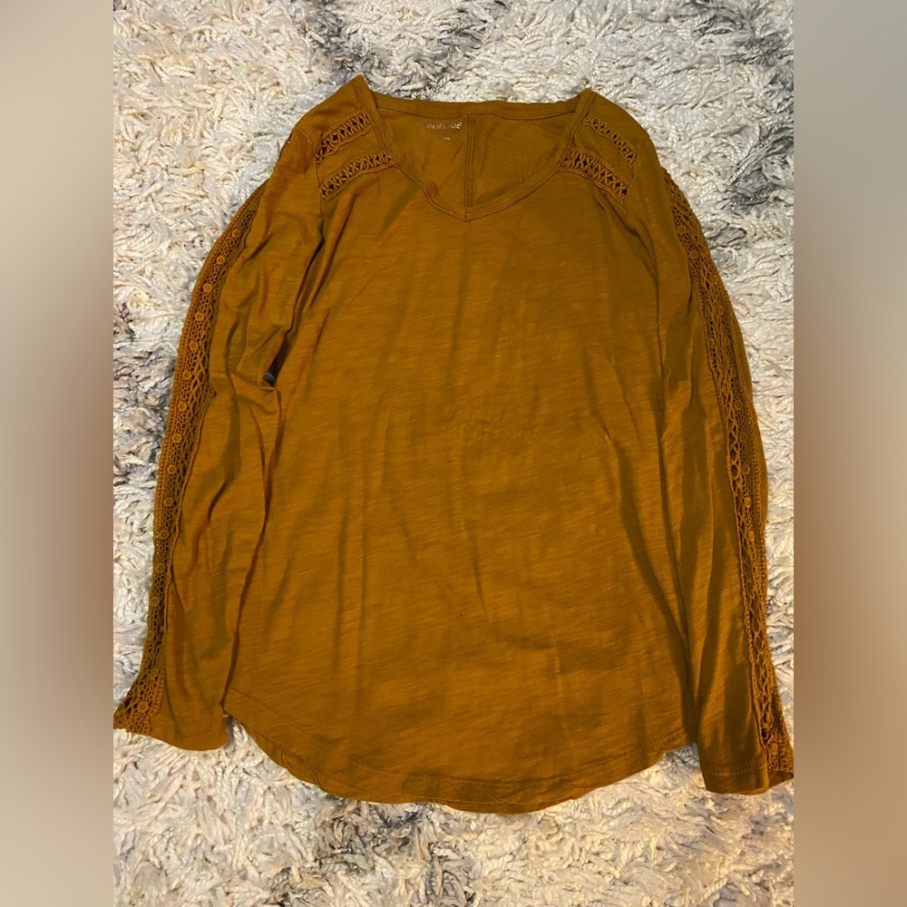 Detailed sleeves. Detailed neckline. Mustard color, women’s size S. Maurices